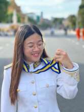 Ms. S with graduation medal
