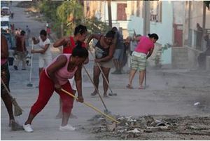 Residents of Santiago clear debris