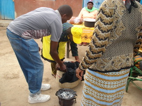Pot with boiling food is placed in fireless cooker