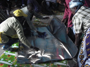 Reflective Paper is spread on waxed cardboard
