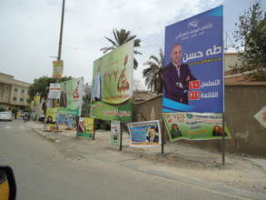 Campaign posters fill the streets.