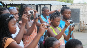 The girls taking pictures of Takun J's performance