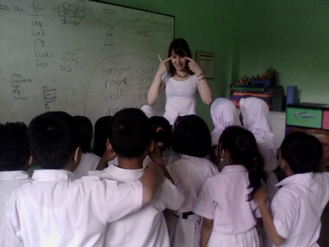 Our visiting friend, ms. Monica, teaching the kids