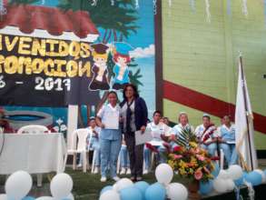 Flory receiving her diploma