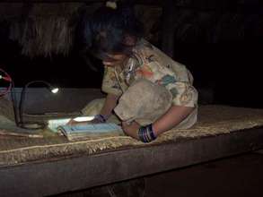 Schoolgirl with 2-LED lamp ~ studying