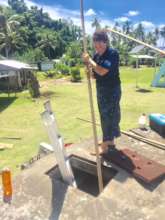 Hard at work repairing the rainwater tanks