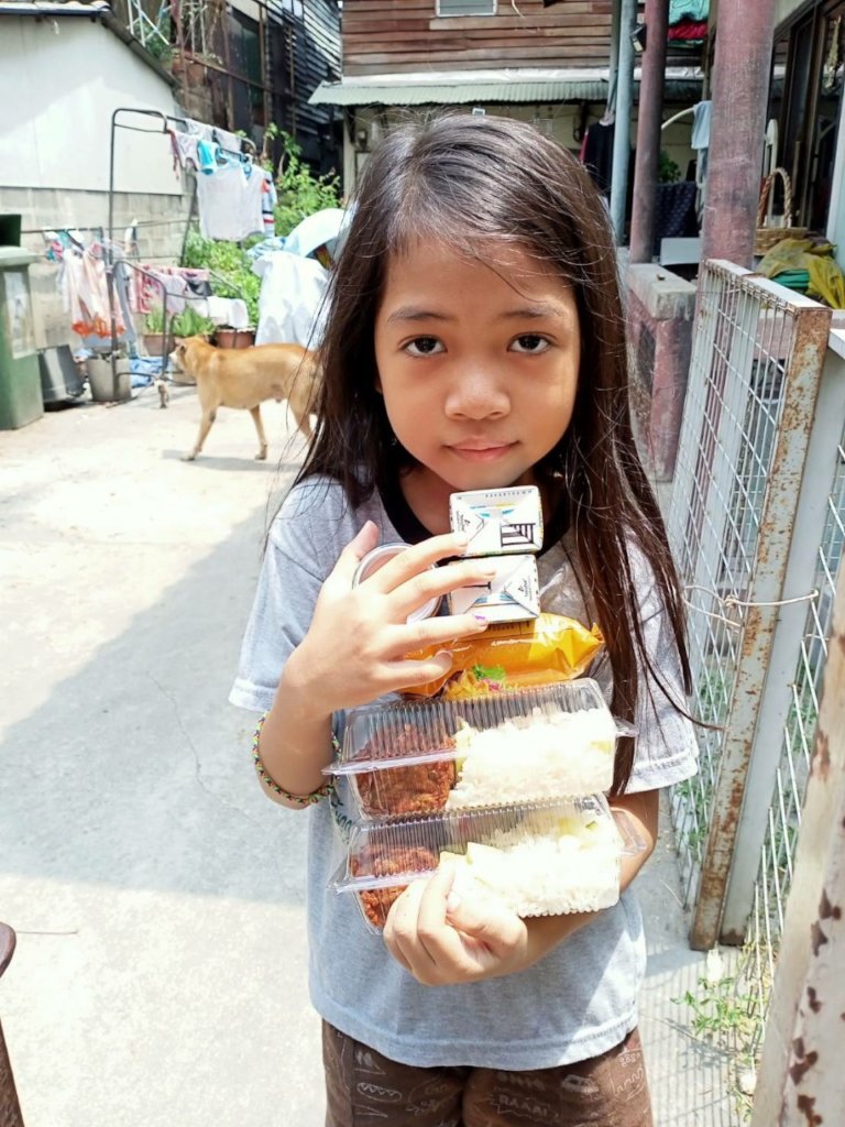 Rice for malnourished slum kindergartners