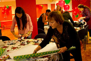 President & CEO Lori Kaplan wraps gifts