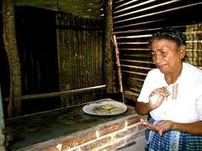 Making tortillas on her new stove.