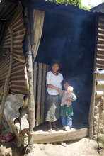 Children in doorway with smoke pouring out