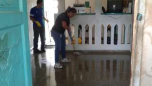 Volunteers cleaning house