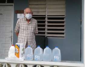 Participant with drinking water gallons
