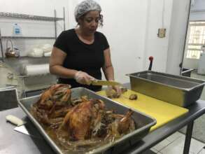 Cook preparing turkey for Thanksgiving