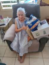 Participant with food, PR Food Bank activity