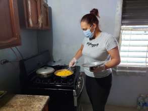 Housekeeper cooking for participant