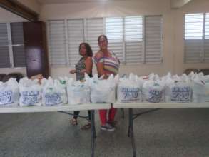 Cook & driver with groceries to distribute