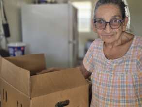Community elder with food box
