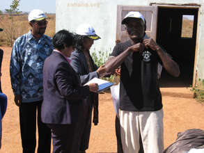 Maurice putting on his new t-shirt