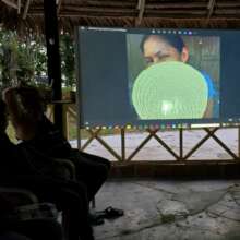 Artisans reviewing their photos in night session