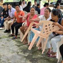 Artisans playing cooperative chair game