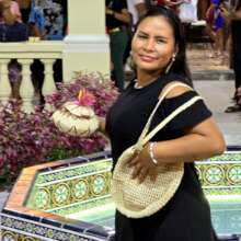 Artisan Tarsy modeling with crafts at exhibition