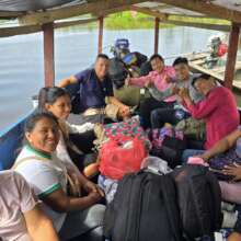 Artisans traveling by boat to workshop