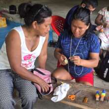 Artisans Bertha & Morelia making painted buntings