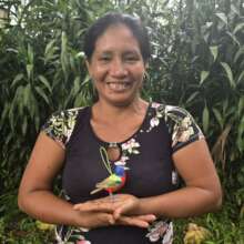 Artisan Maria with chambira painted bunting