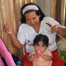Sarita weaving bird with baby in Chino workshop