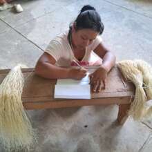 Bora woman reflecting on her passions at workshop