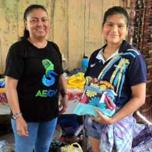 Yully giving Days for Girls kit to young woman