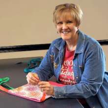 Volunteer assembling Days for Girls kit