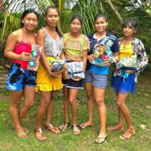 Five young women with Days for Girls kits
