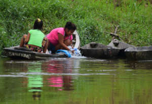 5. Women washing closes in the river