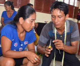 Pablo shows artisan how to cut wire with pliers