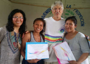 Facilitators giving participant a certificate