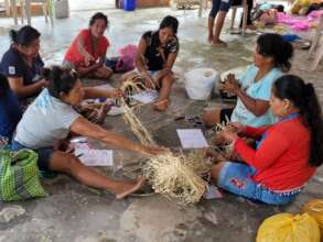 Amazonas artisans making bluebird ornaments
