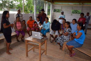 Ania discussing CACE craft project in Nuevo Peru