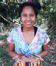 Artisan with woven butterflies at Estiron workshop