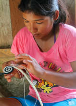Artisan starting woven hotpad. Photo: Davila/CACE