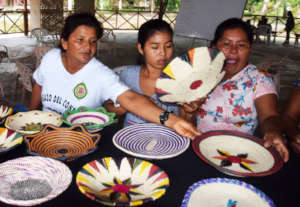 Artisans selecting best baskets for display