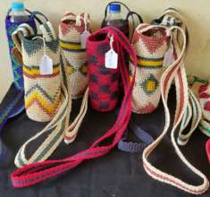 Bottle carriers at practice fair for tourists