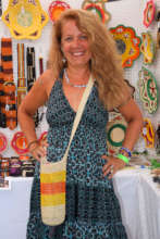Lisa with woven bottle carrier at CACE booth