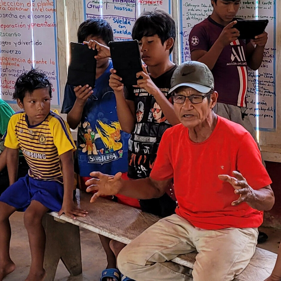 School children recording medicinal plant talks