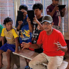 School children recording medicinal plant talks