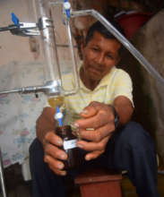 Bora team member collecting rosewood essential oil