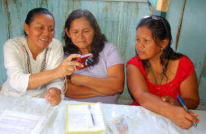 CACE donating camera to FECONA native leaders