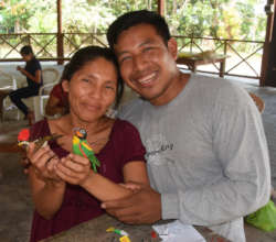 Edson and his artisan wife with two birds