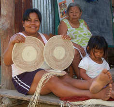Bora artisan with woven chambira fiber placemats