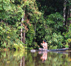 Bora fisherman in canoe on Yaguasyacu River